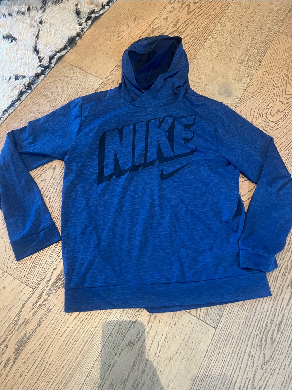 Blue Nike long-sleeved tshirt pullover with hoodie. Great for layering.